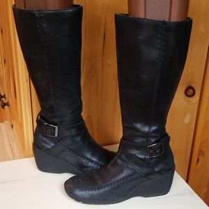 Tall black wedge leather boots